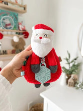 Carregar imagem no visualizador da galeria, Itzy Ritzy - Brinquedo de pelúcia e mordedor Holiday Itzy Lovey™ - Nick, o Papai Noel
